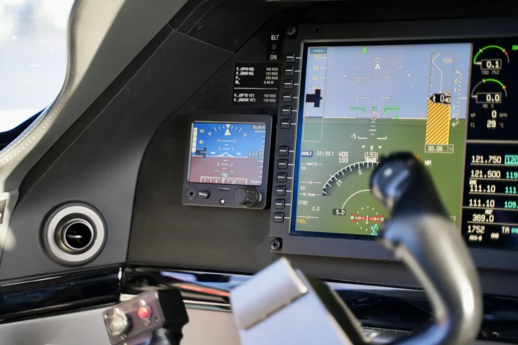 Close-up of flight displays inside a Pilatus PC12 NGX cockpit showing navigation instruments.