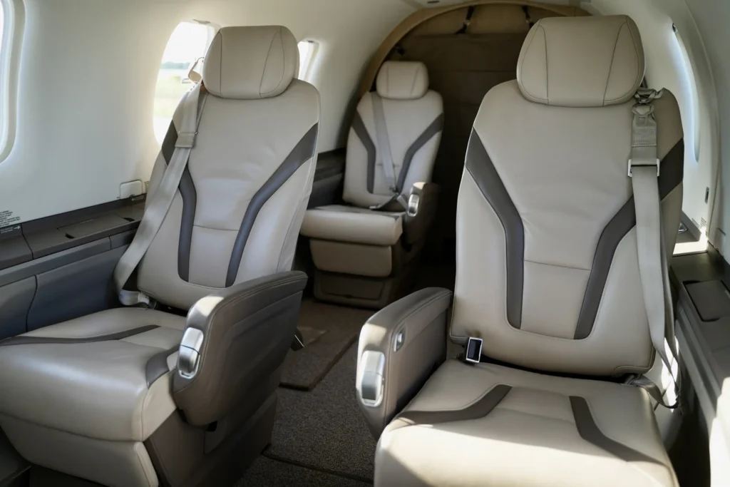 Side view of Pilatus PC12 NGX passenger cabin with premium leather seating.